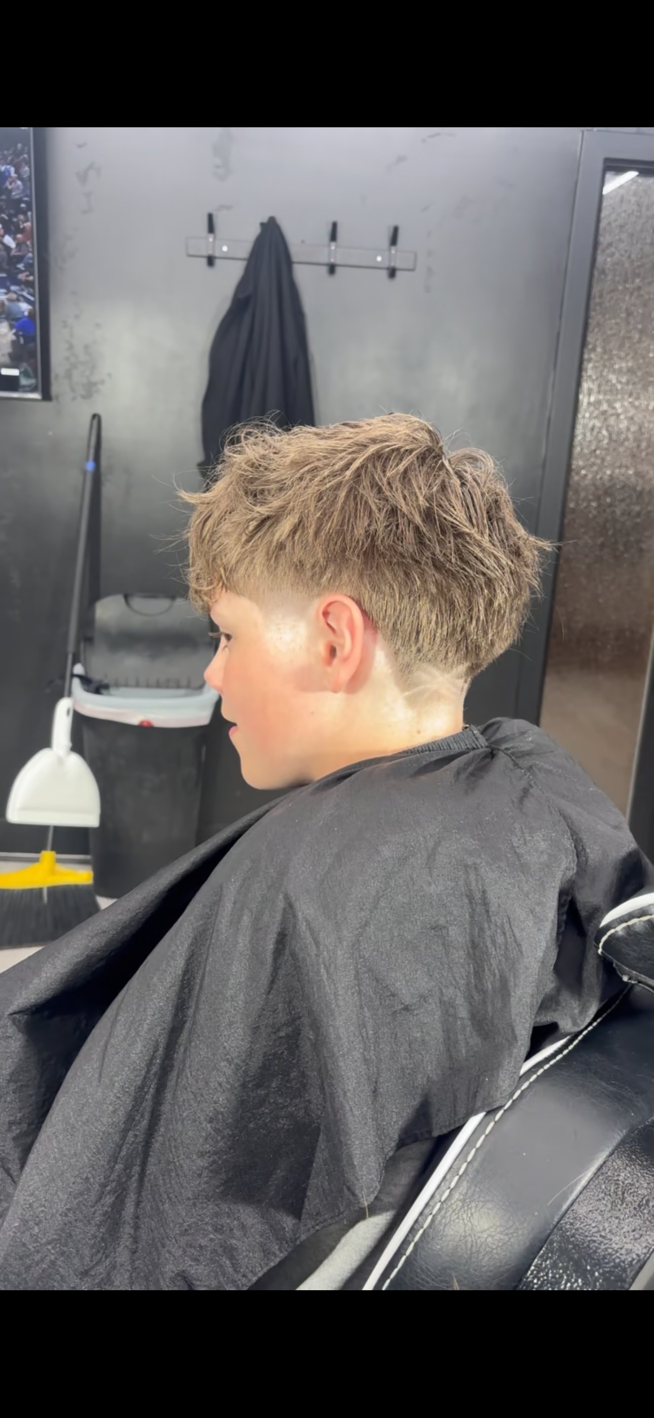 Low fade haircut, side profile