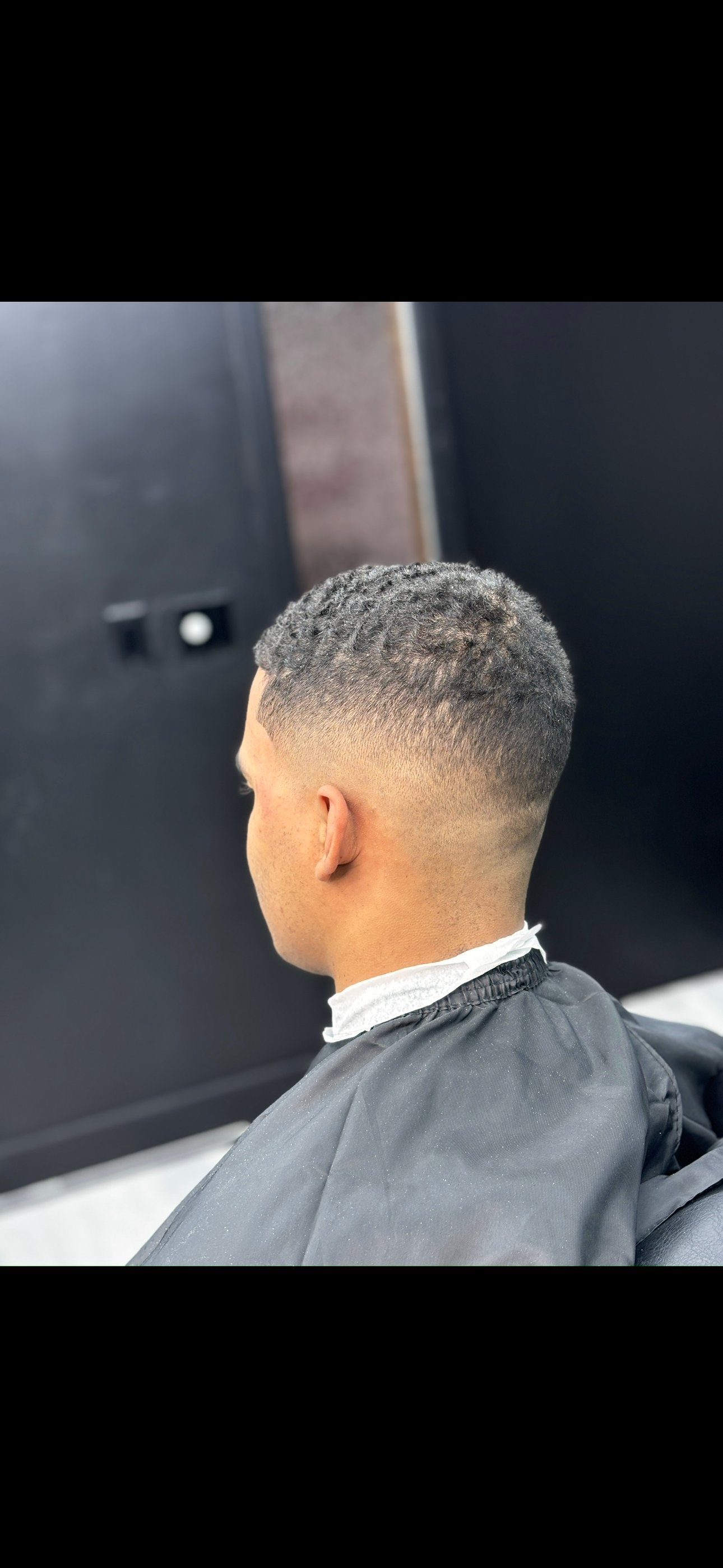 Textured crop fade haircut, side profile
